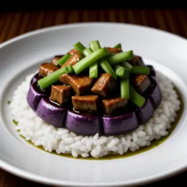 Stir-fried eggplant and minced pork in a rich brown sauce served with a side of rice